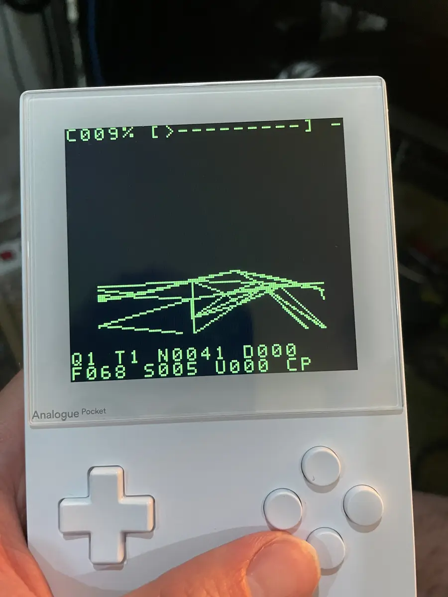 Wireframe procedural terrain and rendering progress HUD running on a white Analogue Pocket